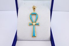 Turquoise Ankh Cross 18K Gold Pendant | Key of Life Egyptian crucifix pendant Gold Pendant ancient Egyptian revival jewelry ankh charm 4.5Gr Weight Approximate : 4.5 Gr Height : 1.8" = 48 mm Width : 0.7" = 18 mm ✔ IT IS Tested & SIGNED WITH THE EGYPTIAN Gold Government HALLMARK FOR 18K GOLD to Ensure      Authenticity. ✔ Lovely gift idea ABSOLUTELY GORGEOUS, LOOKS FABULOUS ON. ✔ 100% Egyptian handmade. ✔ Condition: A brand-new, exactly as on the photos. ★ GIFTS ✔ All items are packaged in a pape 14k Gold Jewelry With Inlay As Gift, Formal Turquoise Engraved Jewelry, Luxury Yellow Gold Turquoise Necklace As Gift, Spiritual Hallmarked Turquoise Jewelry, Spiritual Turquoise Jewelry With Hallmark, Turquoise Hallmarked Jewelry Gift, Turquoise Hallmarked Jewelry For Gift, Blue Ankh Jewelry Gift, Spiritual Gold Jewelry With Inlay