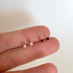 "The perfect tiny studs - these cz studs look beautiful with everything. Faceted round brilliant cubic zirconia hand-set in a high quality 4-prong setting. Understated and undeniably elegant, these are the perfect everyday stud earrings. ♦ Sold individually (1 stud) or in pairs (2 studs) ♦ Choose between Black or White cubic zirconia on the dropdown menu * D E T A I L S * ∙ Material: .925 Sterling Silver or 18K Gold Plated over .925 Sterling Silver ∙ Stone: White OR Black Zirconia ∙ Dimensions: Gift Diamond Accented Round Piercings, Dainty Piercings With Diamond Accents As Gift, Dainty Piercings With Diamond Accents For Gifts, Tiny Gold Studs, Dainty Gold Earrings, Everyday Earrings Studs, Gold Diamond Studs, Ear Jacket Earring, Minimalist Studs