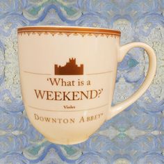 a coffee cup with the words, what is a weekend? written in brown on it