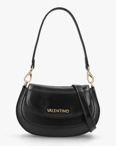 Valentino Bags Type Relove Recycle Black Shoulder BagThe Valentino Bags Type Relove Recycle Black Shoulder Bag is part of the New Season collection. This every style is crafted from a premium smooth PU material with gold tone hardware. The secure magnetic snap front flap allows access to the main compartment as well as handy inner zip and slot pockets. Carry by either of the detachable strap. Valentino Bags branding completes the design.Technical information: PU, Gold Tone Hardware, Magnetic Snap Front Flap, Inner Zip & Slot Pocket, Detachable Shoulder, Detachable Cross-Body Strap, Valentino Bags Branding, Includes Dust BagDimensions: L23 x H16 x D5.5 CMValentino Bags -Relove Recycle Collection Valentino Bags, Black Shoulder Bag, Black Colour, Everyday Wardrobe, New Season, Valentino Garavani, Cross Body, Bags Women, Women's Accessories