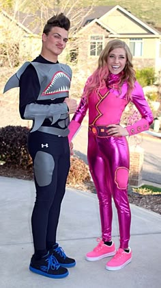 two people in costumes standing next to each other