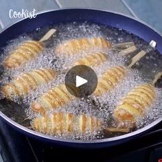 the food is being cooked in the pan on the stove