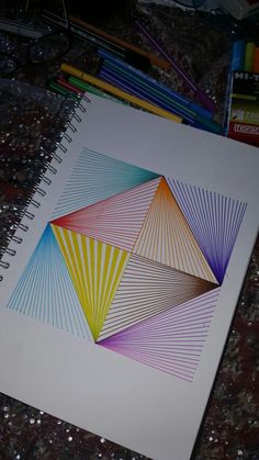 a drawing with colored pencils on top of it