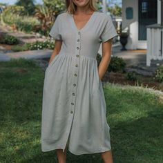 A Gorgeous Everyday Dress! This Piece Has Subtle Stripes Throughout, The Buttons Are Functional, And The Bottom Half Is Lined. Pair This With Our Favorite Market Baskets And Leather Sandals For A Look You’ll Want To Wear This Spring And The Next. The Waistline Is Fixed And Not Elastic So Make Sure To Cross Reference The Measurements For A Perfect Fit. We Also Carry This Is A Lovely Cream. S: 47” Length / 34” Bust / 30” Waist M: 47” Length / 36” Bust / 32” Waist L: 47” Length / 38” Bust / 34” Wai Flowy Buttoned Dress For Garden Party, Casual Maxi Dress With Buttons For Garden Party, Neuflora Dresses, Beige Buttoned Dress For Garden Party, Everyday Dress, Face Book, Market Baskets, Cross Reference, Everyday Dresses