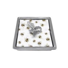 a small metal box with bees on it