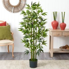 a potted plant sitting on top of a wooden floor next to a table and chair