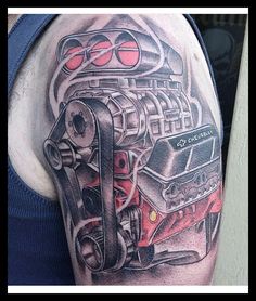 a man with a tattoo on his arm that has a car engine in the middle