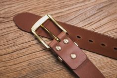 "The 1.5\" wide leather belt is constructed from 10 oz heavyweight Italian vegetable-tanned leather. The item features a solid brass hardware and brass Chicago screws. In many occasions, the leather keeper is a weak spot of a belt. With the brass keeper on this belt, it would surely be the last belt you would ever need. We pay attention to the slightest details, the edges of the belt is beveled and hand burnished with natural beeswax to achieve a smooth and glossy edge finish. With occasional ma Italian Vegetables, Chicago Screws, Brown Leather Watch, Wide Leather Belt, Buy Watches, Brass Buckle, Dark Brown Leather, Vegetable Tanned Leather, Brass Hardware