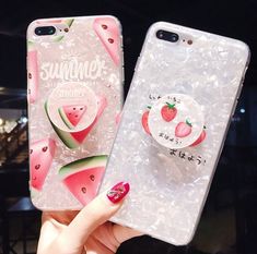 two phone cases with watermelon designs on them, one has a strawberry and the other has a cupcake