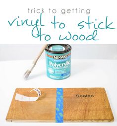 a can of paint next to a wooden board with the words trick to getting vinyl to stick to wood