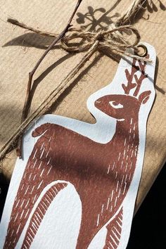 a package wrapped in brown paper with a deer design on it