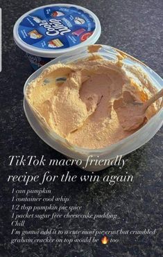 there is a bowl of ice cream next to a container of yogurt