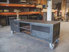 a large metal cart sitting inside of a garage