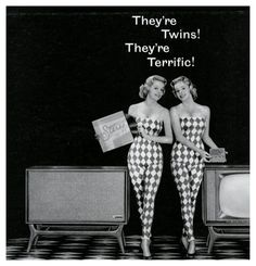 two women standing next to each other in front of tvs with the words they're twins