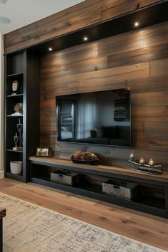 a living room with wood paneling on the wall and entertainment center built into it