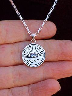 "Surfer men or women gift - Delicate sun & wave necklace made of 925 sterling silver. Great unisex summer pendant gift for men, women or teens. Stay safe / Travel safe/ love for the ocean / Graduation/ Ocean Lover theme symbol gift for both him or her. Great summer birthday, ocean lover or a boat owner gift of happiness and proud. High Quality, beautiful necklace! You will LOVE to wear yourself or give as present! PRODUCT DETAILS ✤ Chain: 925 Sterling Silver long box special chain ✤ Pendant: 0.7\" (=18mm ) 925 sterling silver. ✤ Length: 16\" to 24\" ✤ Shipping expenses are included in the jewelry cost 14 inches (35.5 cm): choker that wrap high around the neck - Kids size 15 inches (38 cm): closely around the neck - Kids or slim adult 16 inches (40.5 cm): at neckline 17 inches (43 cm): aver Ocean Themed Gifts, Surfing Jewelry, Ender Man, Surfer Men, Summer Pendant, Surfboard Decor, Surf Jewelry, Sunset Surf, Wave Necklace