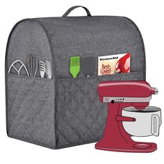 a gray backpack with a red mixer and kitchen utensils in it