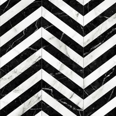 black and white marble chevroned pattern with diagonal stripes on the floor in an art deco style