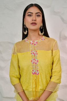 Yellow jacket with hand embroidered sequins, cutdana and moti. Paired with a plain palazzo. - Aza Fashions Festive Straight Kurta Tops With Cutdana, Reception Long Sleeve Kurta With Multicolor Embroidery, Multicolor Embroidered Long Sleeve Kurta For Reception, Long Sleeve Multicolor Embroidered Kurta For Reception, Long Sleeve Embroidered Chanderi Choli, Festive Floral Embroidered Designer Outerwear, Festive Long Sleeve Outerwear With Cutdana, Festival Zari Work Straight Kurta Outerwear, Festive Zari Work Straight Kurta