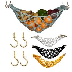 fruit in a basket hanging from hooks, with bananas and oranges attached to it