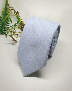 "I AM CURRENTLY AWAY FOR THE MONTH OF DECEMBER. YOU ARE WELCOME TO  PLACE YOUR ORDER, HOWEVER ALL ORDERS WILL BE SHIPPED OUT IN THE FIRST WEEK OF JANUARY. PLEASE FEEL FREE CONTACT ME IF YOU HAVE ANY QUESTIONS.Store Home Page - https://ivoryrosebridalau.etsy.com Our Dusty Blue Neck Tie  is the perfect tie for the groom or groomsmen on their wedding day.  Matching Pocket square and Adult or Child Bow Ties are also available. Made  from 100% Cotton our dusty blue tie has a beautiful plush velvety f Blue Suit And Tie Accessories For Wedding, Blue Classic Wedding Suit And Tie Accessories, Classic Light Blue Formal Ties, Dapper Blue Wedding Ties, Blue Suit And Tie Accessories For Groom, Elegant Light Blue Suit And Tie Accessories For Wedding, Light Blue Accessories For Black Tie Event, Dapper Blue Ties For Groom, Blue Wedding Suit And Tie Accessories