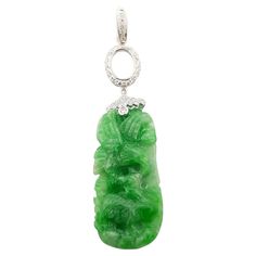 Jade 19.27 carats with Diamond 0.26 carat Pendant set in 18 Karat White Gold Settings (chain not included) Width: 1.5 cm Length: 6.0 cm Total Weight: 6.04 grams "We first opened doors in 1980 when it was then situated in the vicinity of the Victory Monument; a small and modest storefront with a couple of counters. From its humble beginnings to where it stands today, our company has proven its abilities as a jeweler. Since the beginning, we have been supplying fine quality pieces to dealers, whol Diamond Pendant Set, Diamond Pendant Sets, Carved Jade, Jade Carving, Pendant Set, Diamond Pendant, Jewelry Necklace Pendant, Jade, Jewelry Necklaces