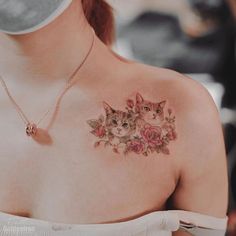 a woman with a cat tattoo on her chest