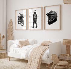 a bedroom with three pictures on the wall