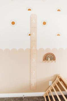 a child's room with a ruler on the wall