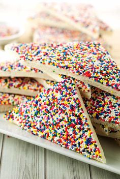 several pieces of cake with sprinkles on a plate