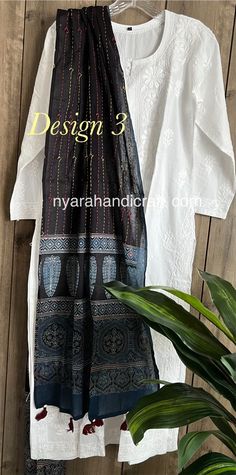 Pure cotton white kurta accompanied by hand printed pure cotton Ajrakh Kantha stole. Team it with Chikankari leggings or a palazzo for a stylish look ! Kurti Length:46 inches  Stole : 94 in by 20 in "DESIGNS MAY VARY" Ajrakh stole is hand printed using natural dyes,some inconsistencies may be present. Wash separately, color may bleed. Black Cotton Dupatta With Block Print, Black Cotton Dupatta With Bandhani Print, White Kurta, Kurta With Pants, Muslin Cotton, Womens Tunics, White Cotton, Natural Dyes, Pure Cotton