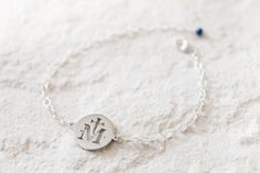 This Marian Cross bracelet makes the perfect gift for any Catholic woman. It makes for a great Marian consecration gift for you or your loved ones as a little reminder that you are under the protection and love our our beloved Blessed Mother. + Totus tuus Maria! + D E T A I L S * 3/4 inch Marian Cross pendant is stainless steel * Hand-wrapped Lapis Lazuli stone dangles from end. * Chain and clasp are sterling silver. * Bracelet is adjustable. Also available in gold: https://www.etsy.com/listing/ Engraved Silver Rosary Bracelet As Gift, Nickel-free Rosary Bracelet For Gift, Nickel-free Round Rosary Bracelet Gift, Marian Consecration, Mother Bracelet, Catholic Bracelet, Catholic Women, Mothers Bracelet, Beautiful Prayers