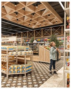 an artist's rendering of the interior of a grocery store, with people shopping