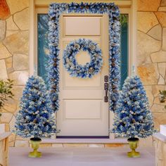 blue wreaths on the front door of a house