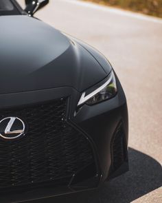 the front end of a black sports car