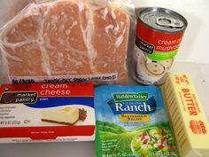 some food is sitting out on the counter top, including cheese and other items for making sandwiches