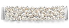 This Yvel bracelet is made with ca.5 ct brilliant cut diamonds and fresh water pearls. The calming effect that the pearls give and the brilliance of the diamonds makes this piece so unique. Every row of diamonds is directed to a different side, that represent the six sides of the universe that allows life. This bracelet is majestic and wears like a glove Material: 18kt White Gold Measurements: 19 cm long x 4.5 cm Total weight: 149.5 gram / 5.280 oz / 96.2 dwt Luxury Pearl Drop Bracelet, Bracelet Pearls, Bracelet With Pearls, Pearl Bracelets, Modern Bracelets, Fresh Water Pearls, Water Pearls, Brilliant Cut Diamond, Pearl Bracelet