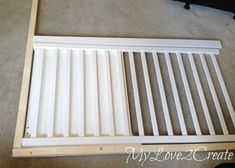 a white radiator cover laying on the floor