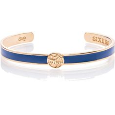 a blue and gold cuff bracelet with the word smile on it's front side