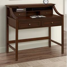 a wooden desk with a clock on top