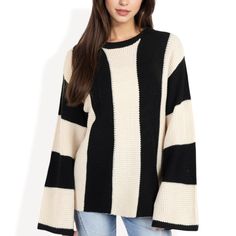 This Anna-Kaci Women's Striped Long Sleeve Sweater features a bold striped design and a unique waffle knit pattern that adds texture and dimension to your look. The relaxed fit and bell sleeves provide a modern touch, making it perfect for casual wear or a chic outfit upgrade. Crafted from a soft, plush fabric, it offers warmth and comfort, ideal for layering over your favorite basics. Pair it with jeans or leggings for an effortlessly stylish look that transitions easily from day to night. Cozy Striped Ribbed Sweater, Knit Crew Neck Tops With Striped Sleeves, Knit Tops With Striped Sleeves And Crew Neck, Knit Sweater With Striped Sleeves For Fall, Black Sweater With Striped Sleeves For Winter, Crew Neck Knit Sweater With Striped Sleeves, Striped Long Sleeve Ribbed Sweater, Knit Crew Neck Sweater With Striped Sleeves, Winter Cotton Sweater With Striped Sleeves