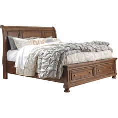 a bed with drawers underneath it and a white blanket on the top of it's headboard