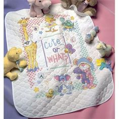 three stuffed animals sitting on top of a baby blanket with the words cute or what?