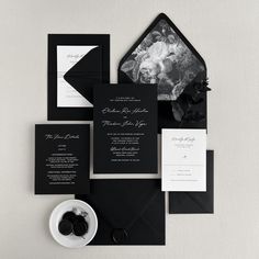 black and white wedding stationery with an envelope