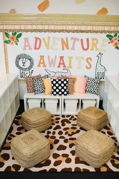 a room with several pillows on the floor and two stools in front of it