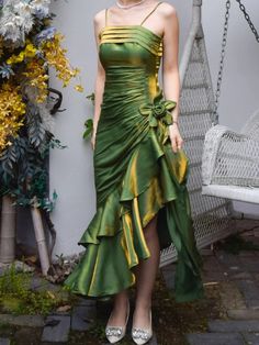 Step into timeless elegance with our Grass Green Vintage Floral Dress. This exquisite prom gown features an asymmetrical hem that adds a touch of modern flair to its classic silhouette. The delicate spaghetti straps gracefully highlight your shoulders, making it perfect for a memorable adult ceremony or any special occasion. The lush grass green fabric evokes a sense of vintage charm while ensuring you stand out in any crowd.  Garment Size   	 		 			Size 			XS 			S 			M 			L 			XL 		 		 			Bust Green Cowgirl Dress, Prom Dress Inspiration Elegant, Midsummer Prom Dress, Hoco Unique Dresses, Hawaiian Homecoming Dress, Luxury Brand Dresses, Hippy Prom Dress, 80s Inspired Prom Dress, Green And Pink Prom Dress