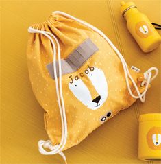 a yellow bag with a bear face on it