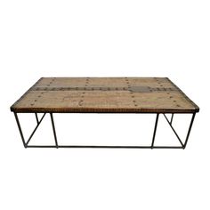 an old wooden table with metal legs and a square top, on a white background