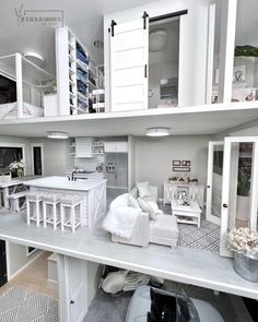 a model house with all white furniture and accessories