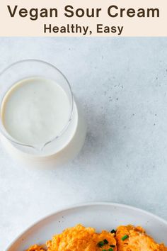 a white plate topped with mashed potatoes next to a glass of milk